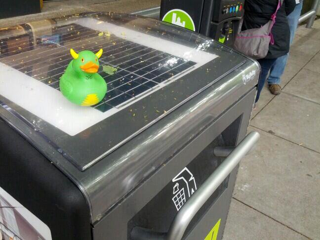 Rex on a Solar Powered Trash Compactor