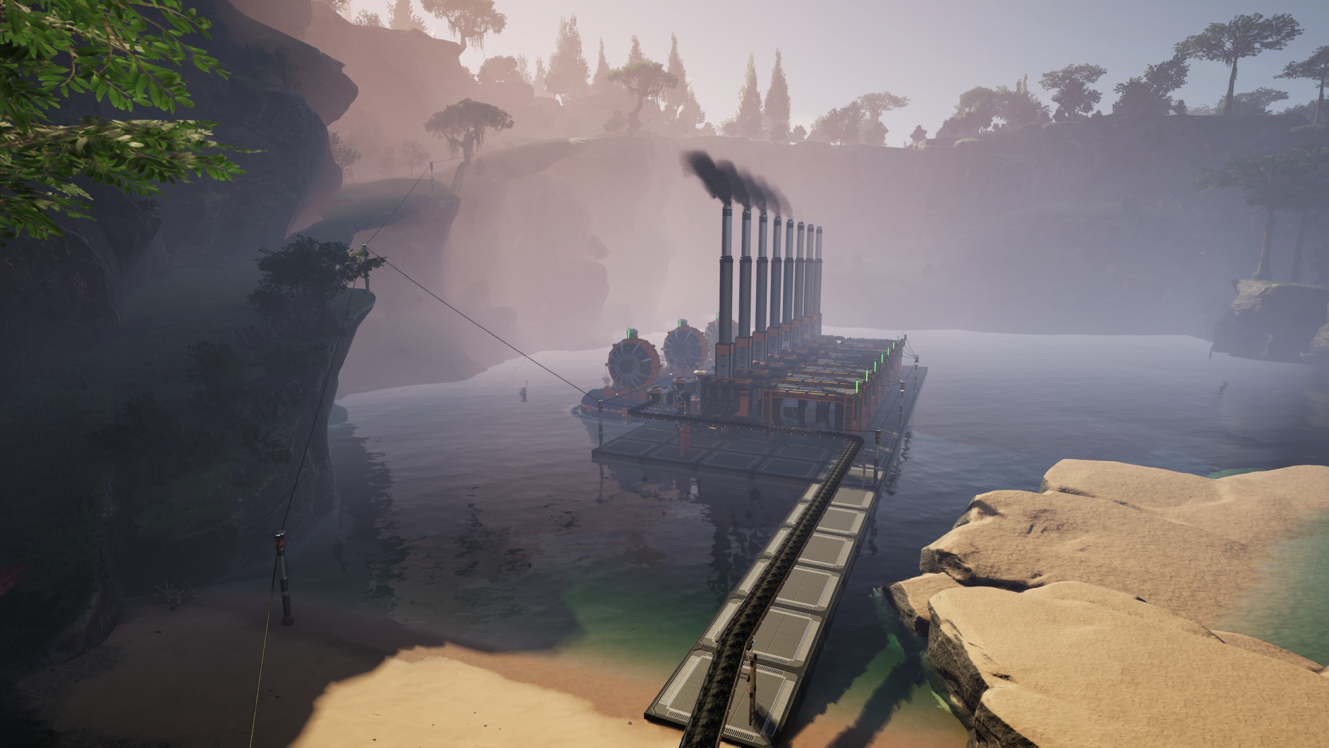 Satisfactory video game screenshot: A lake surrounded by low, grassy cliffs, in which is placed a row of coal-fueled power generators.