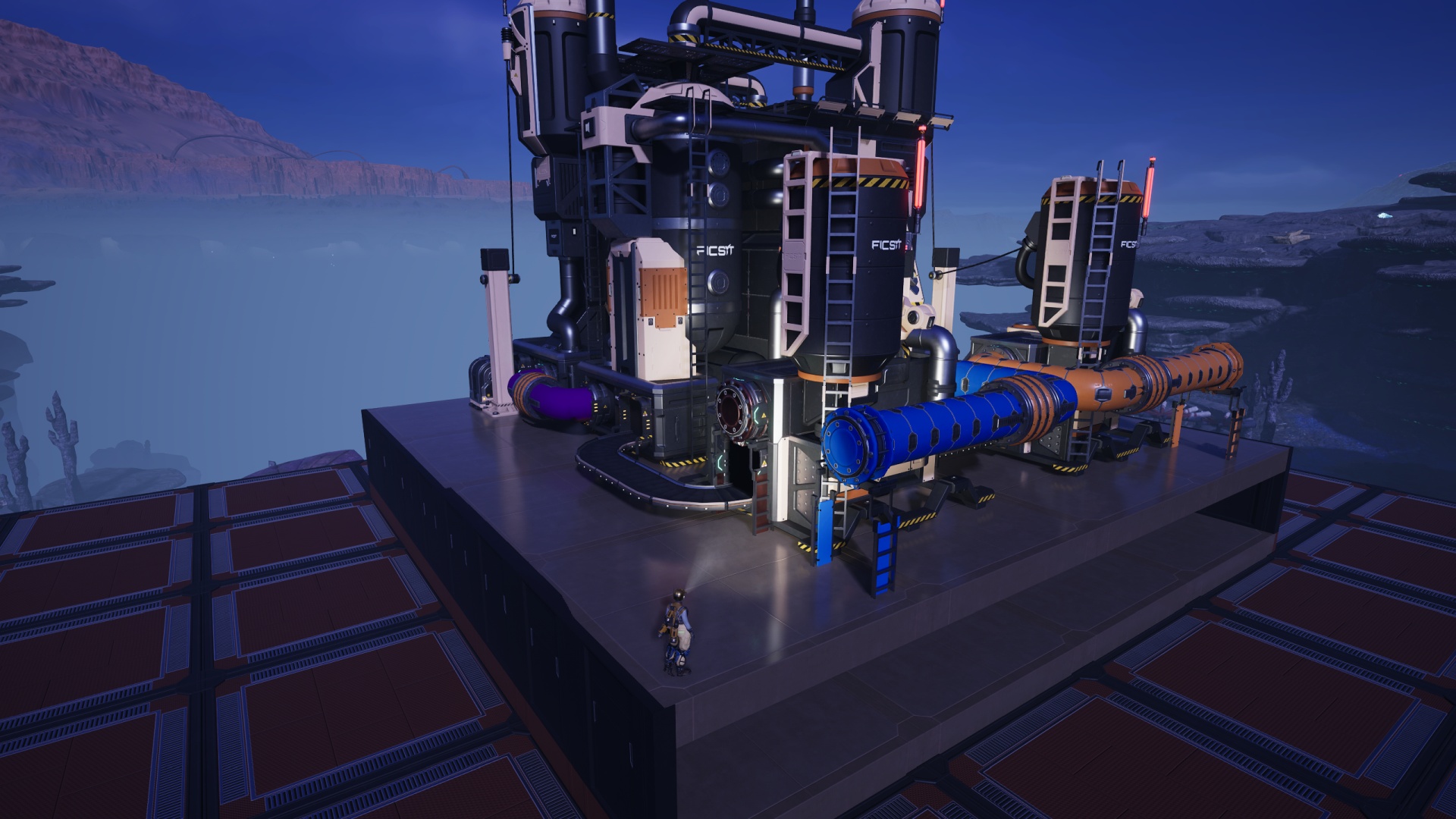 Satisfactory video game screenshot: The Pioneer stands on a blueprinted machinery rig, shining a headlamp onto a Packager machine and the water pipe which helps feed it.