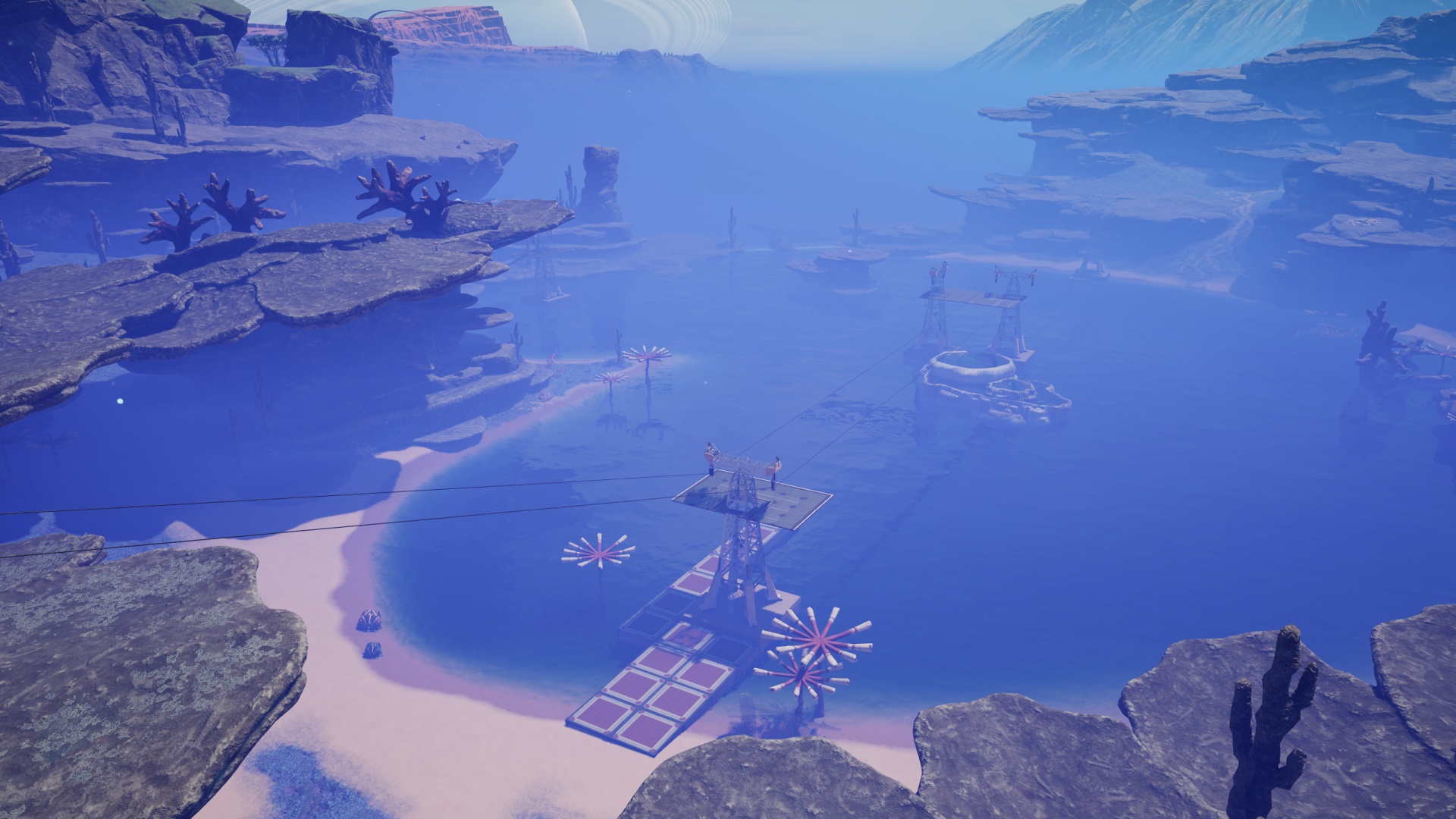 Satisfactory video game screenshot: Looking down upon a blue lake through hazy blue fog. Several power tower structures have been placed in and around the lake.